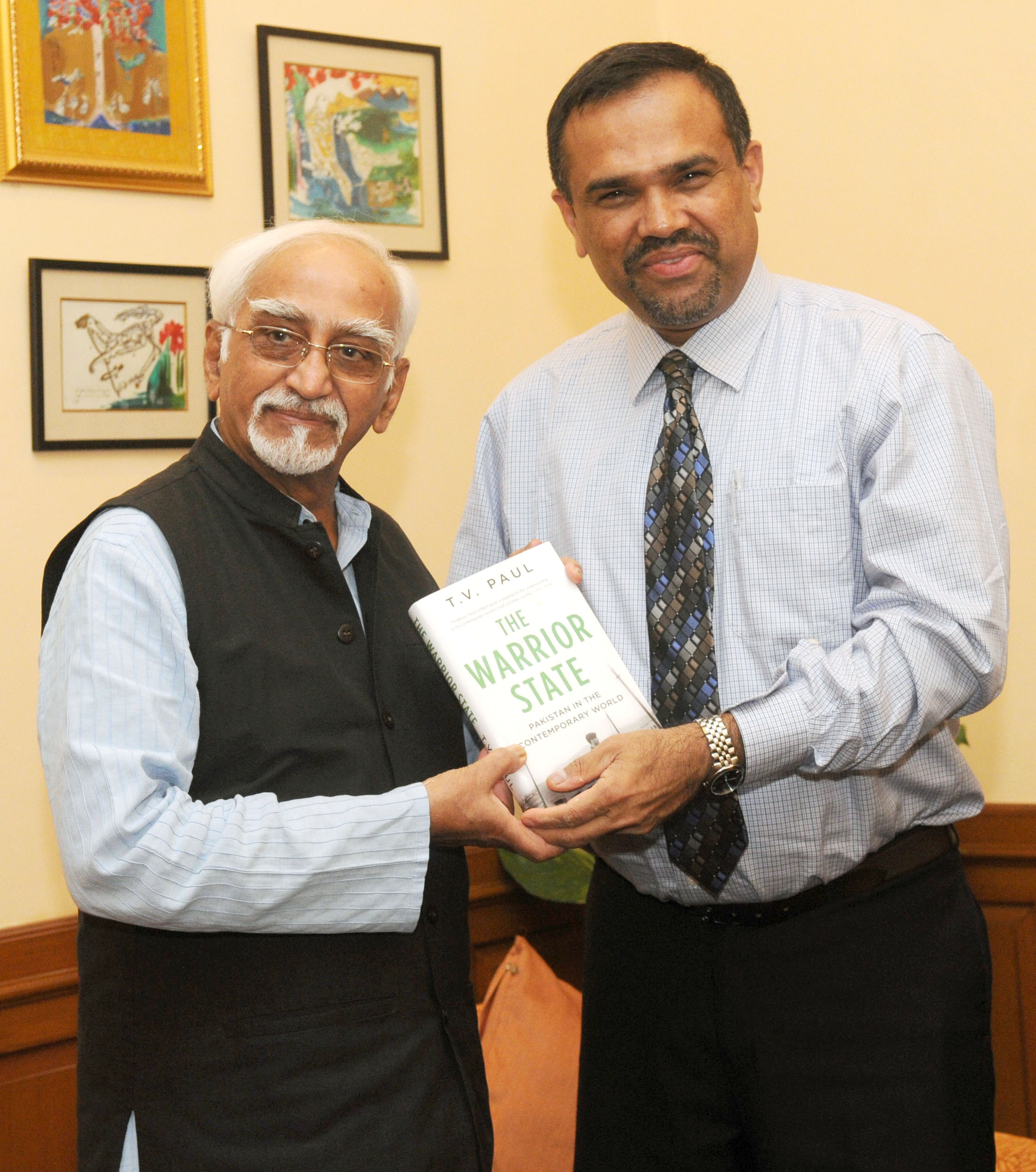 T.V. Paul presents a copy of "The Warrior State: Pakistan in the Contemporary World" to Mohammad Hamid Ansari, Vice President of India, in New Delhi on June 13, 2014.